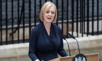 Liz Truss says UK can 'overcome the storm' in first talk as prime minister